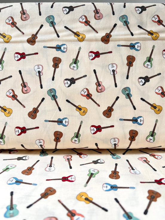 Tossed Guitars- 100% Cotton Fabric- On Cream- 44” Wide