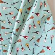 Tossed Guitars- 100% Cotton Fabric- On Light Teal/ Aqua- 44” Wide