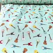 Tossed Guitars- 100% Cotton Fabric- On Light Teal/ Aqua- 44” Wide
