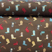 Tossed Cowboy Boots- 100% Cotton Fabric- On Brown- 44” Wide