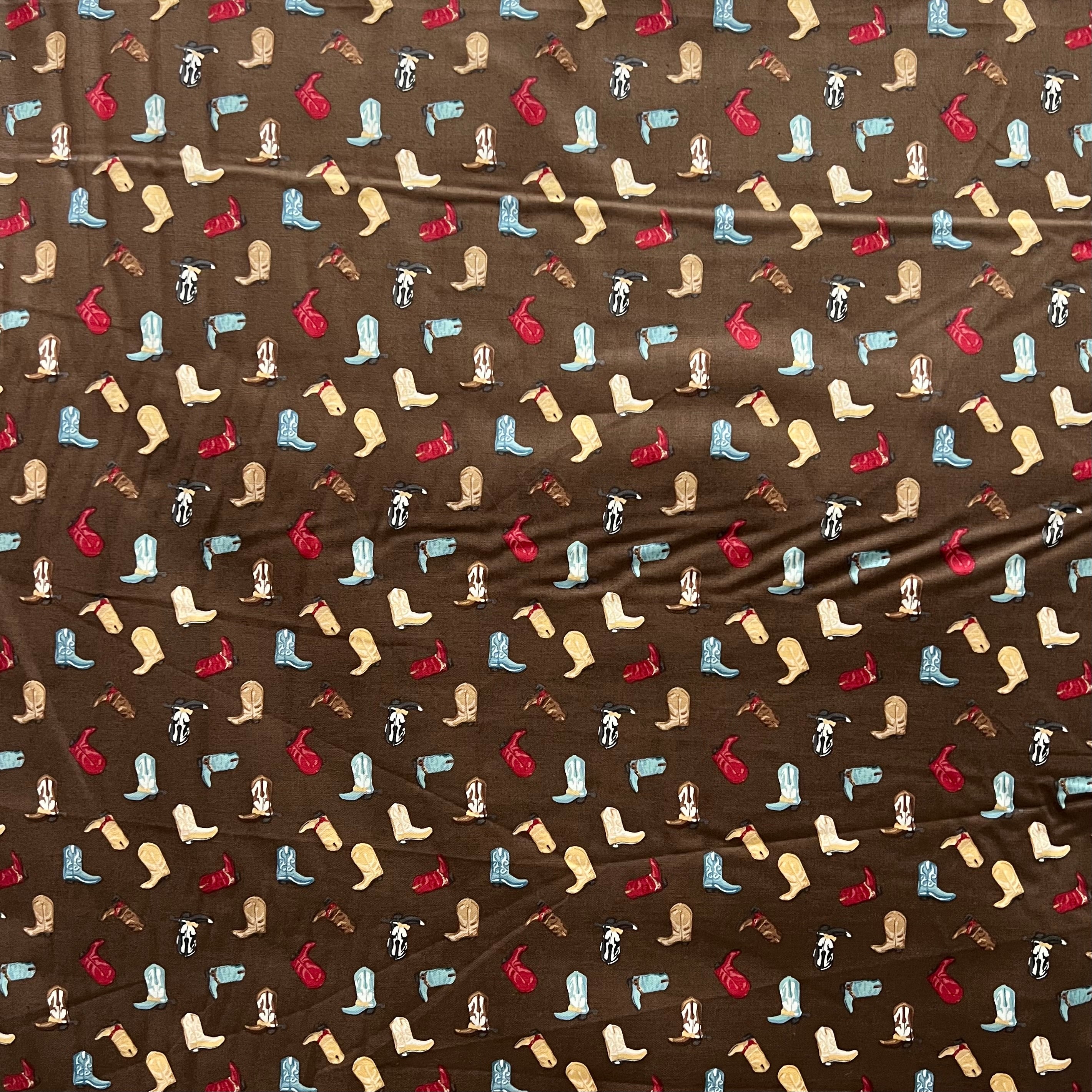 Tossed Cowboy Boots- 100% Cotton Fabric- On Brown- 44” Wide