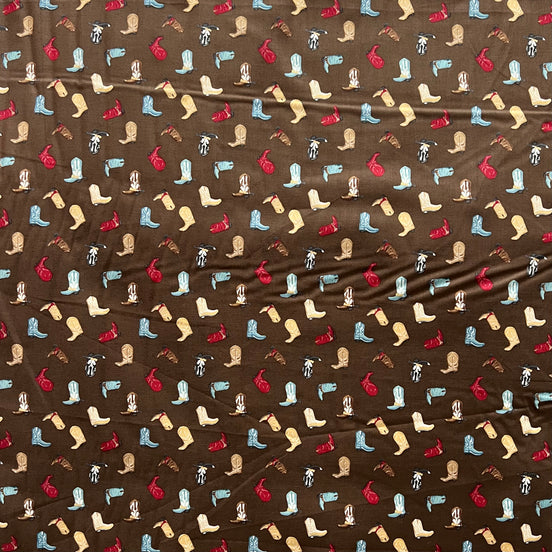 Tossed Cowboy Boots- 100% Cotton Fabric- On Brown- 44” Wide