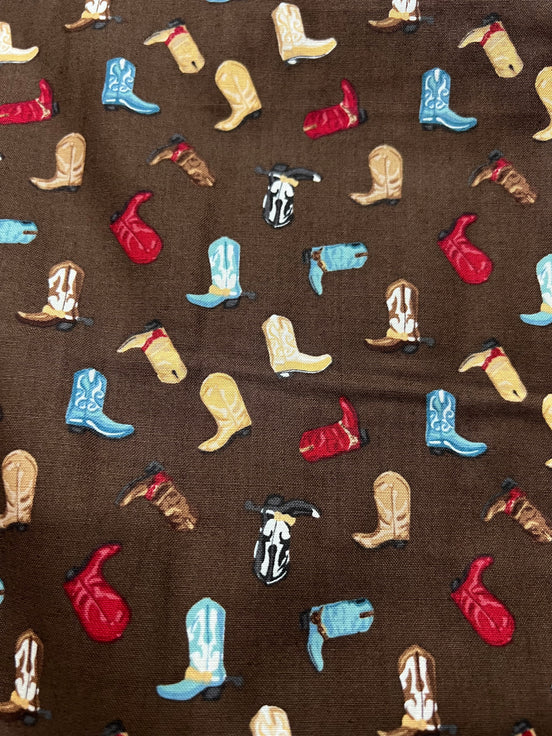 Tossed Cowboy Boots- 100% Cotton Fabric- On Brown- 44” Wide