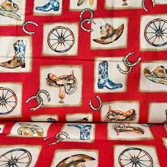 Cowboy Boots, Hats, Saddle, Horseshoe- “Western View"- On Red- 42” Wide- Cotton Fabric